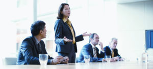 Businesswoman giving presentation in conference room